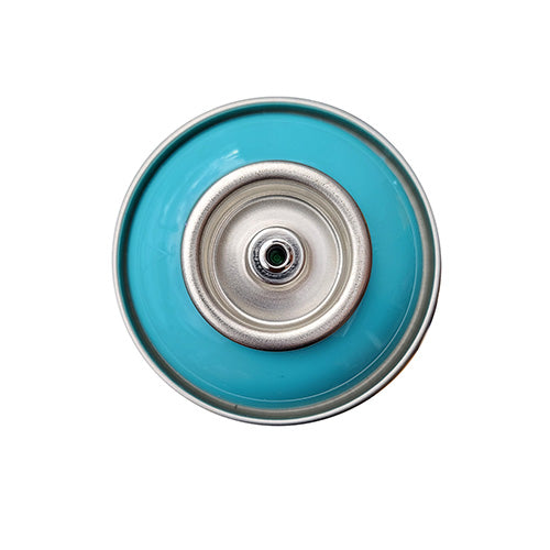 The top of a spray paint can, with a bright teal color swatch in the middle of the silver, metal rings of the can.