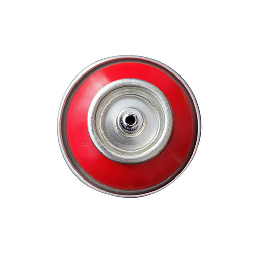 The top of a spray paint can, with a red color swatch in the middle of the silver, metal rings of the can.