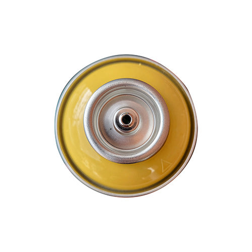 The top of a spray paint can, with a yellow color swatch in the middle of the silver, metal rings of the can.