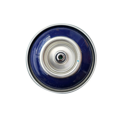The top of a spray paint can, with a navy blue color swatch in the middle of the silver, metal rings of the can.