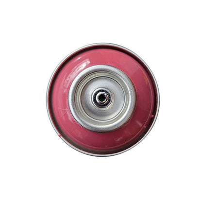 The top of a spray paint can, with a dusty rose pink color swatch in the middle of the silver, metal rings of the can.