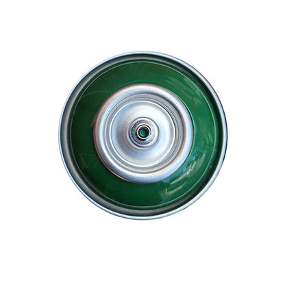 The top of a spray paint can, with a dark green color swatch in the middle of the silver, metal rings of the can.