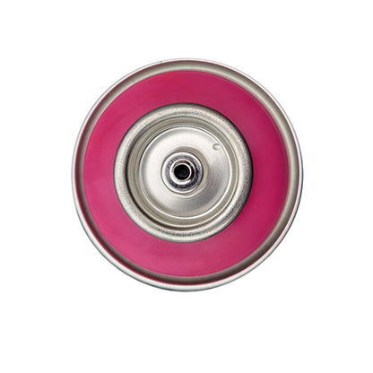 The top of a spray paint can, with a magenta-pink color swatch in the middle of the silver, metal rings of the can.
