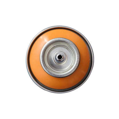 The top of a spray paint can, with a orange color swatch in the middle of the silver, metal rings of the can.