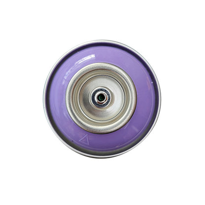 The top of a spray paint can, with a light purple color swatch in the middle of the silver, metal rings of the can.