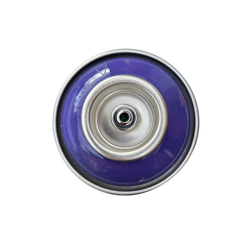 The top of a spray paint can, with a purple color swatch in the middle of the silver, metal rings of the can.