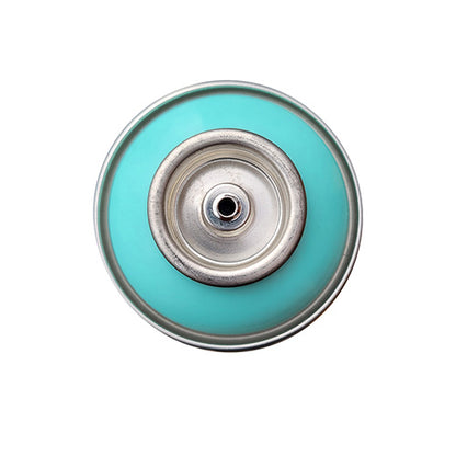 The top of a spray paint can, with a light teal color swatch in the middle of the silver, metal rings of the can.