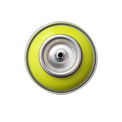The top of a spray paint can, with a bright slime yellow color swatch in the middle of the silver, metal rings of the can.
