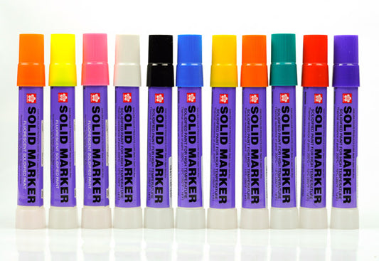 A line up of 11 markers with colored caps, and purple labels that read" SOLID MARKER"